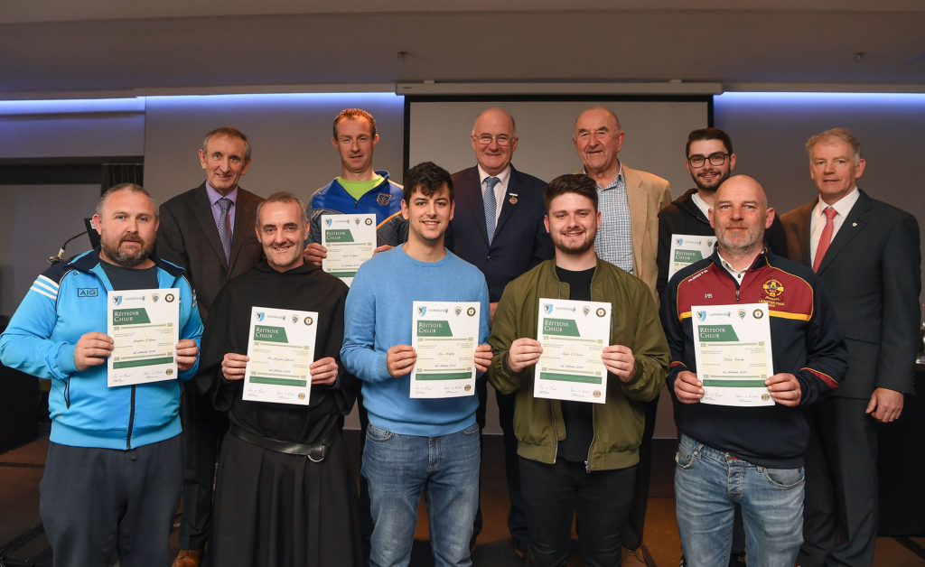 Brother Stephen and a group of people recieving certs on becoming referees.